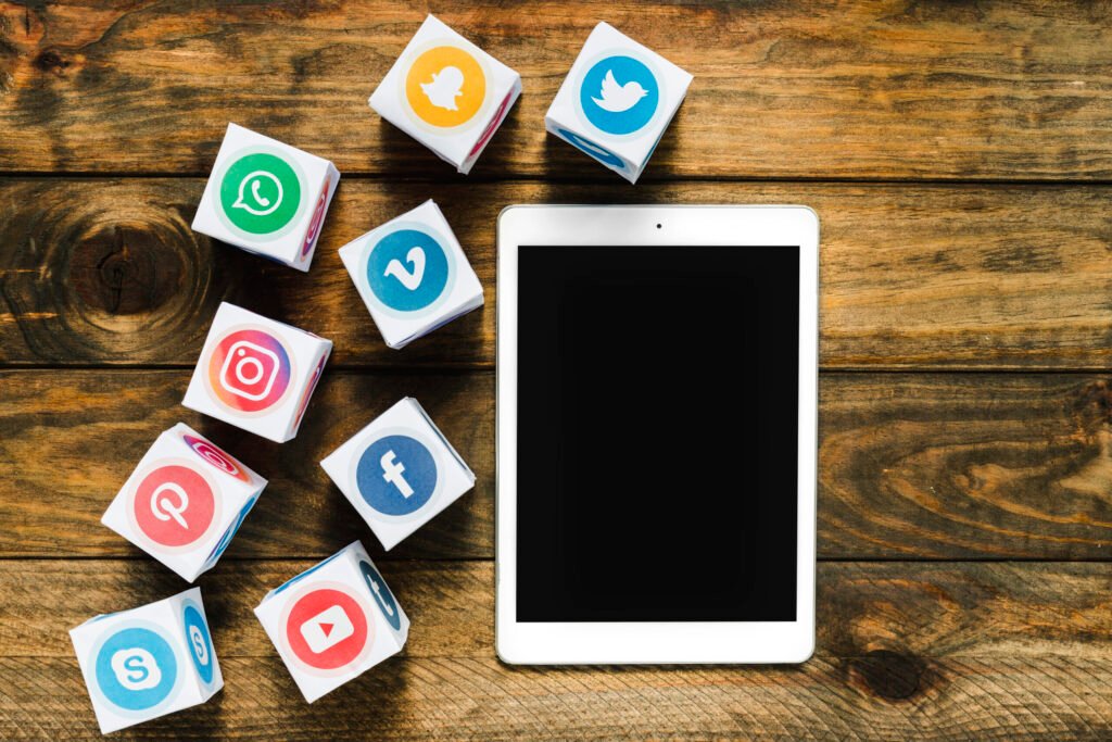 An image illustrating icons of different social media platforms and a tablet
